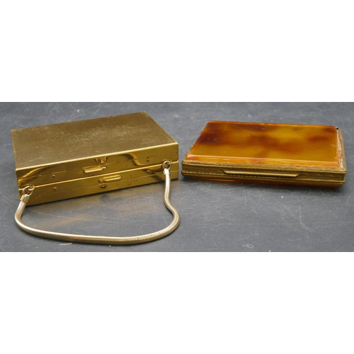 541 - A gilt metal and smoked coloured cigarette case with hinged front, a gilt metal ladies' compact in t... 