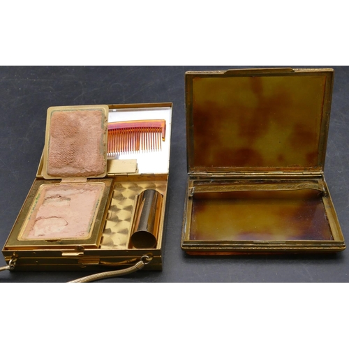 541 - A gilt metal and smoked coloured cigarette case with hinged front, a gilt metal ladies' compact in t... 