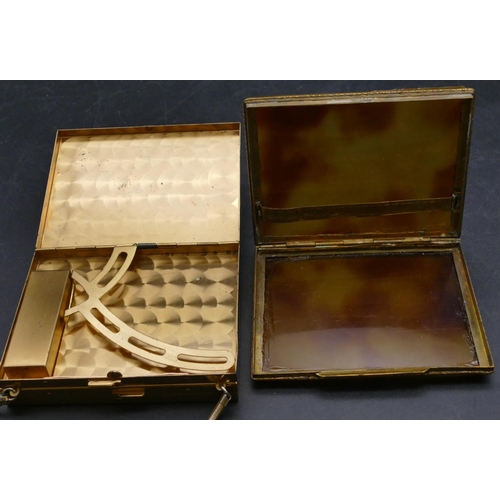 541 - A gilt metal and smoked coloured cigarette case with hinged front, a gilt metal ladies' compact in t... 