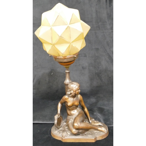 543 - An Art Deco heavy spelter table lamp in the form of a seated female nude holding tambourine with gla... 