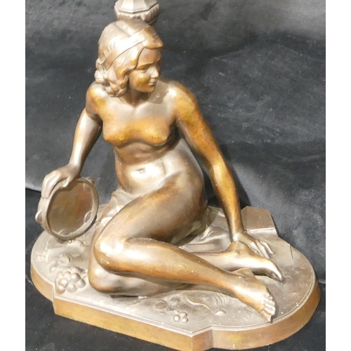 543 - An Art Deco heavy spelter table lamp in the form of a seated female nude holding tambourine with gla... 