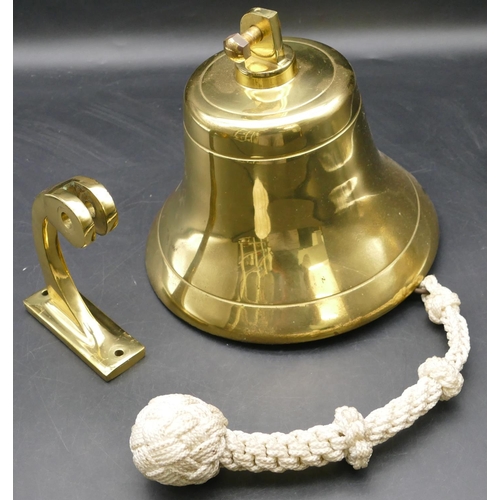 554 - A gilt bronze ship's bell with bracket and chord handle, bell 19cm high, 20cm diameter