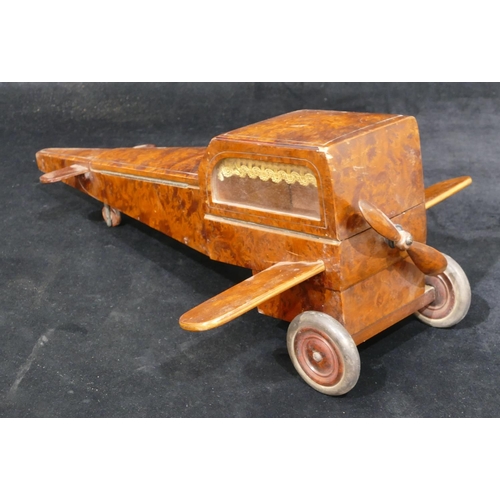 559 - An early 20th Century maple jewellery box in the form of an aeroplane with propeller, 48cm long