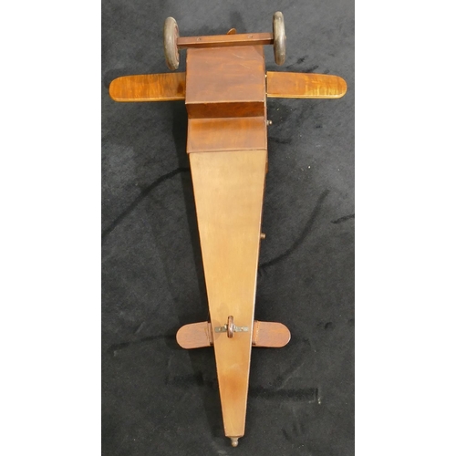 559 - An early 20th Century maple jewellery box in the form of an aeroplane with propeller, 48cm long