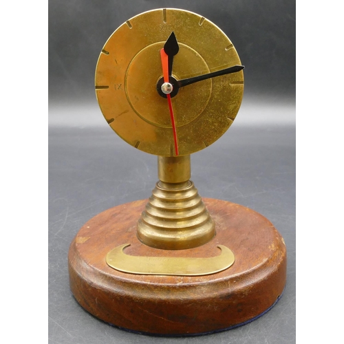 621 - A Trench Art novelty clock on round base inscribed 