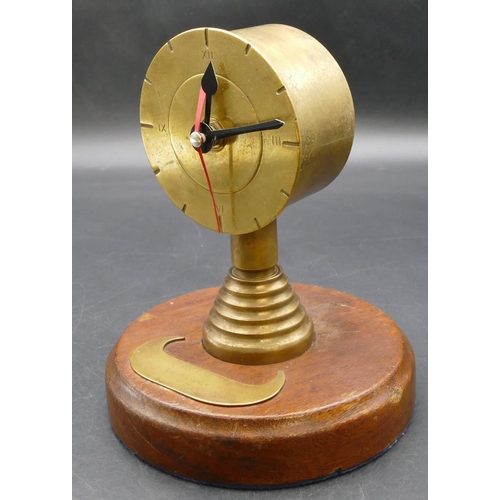 621 - A Trench Art novelty clock on round base inscribed 