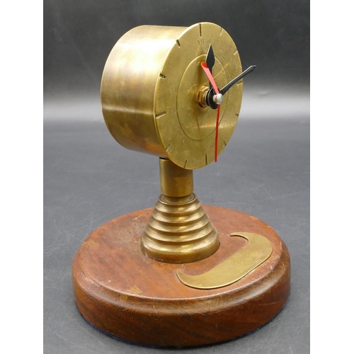 621 - A Trench Art novelty clock on round base inscribed 