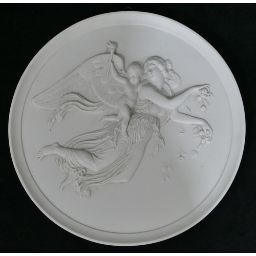 63 - A Parian B & G circular plaque with raised angel and cupid on white ground, 29cm diameter