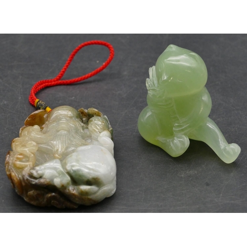 639 - An Oriental hardstone amulet raised figure of a seated gentleman, 7cm high and a jade style hardston... 