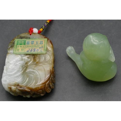 639 - An Oriental hardstone amulet raised figure of a seated gentleman, 7cm high and a jade style hardston... 