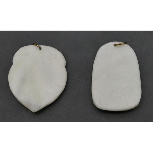 641 - 2 Eastern carved hardstone pendants with raised figure motifs (2)