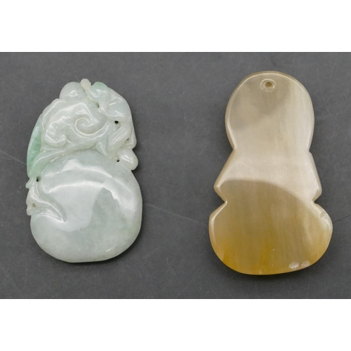 643 - A jade small amulet with fruit and leaf motif, 5cm high, also another hardstone amulet in the form o... 