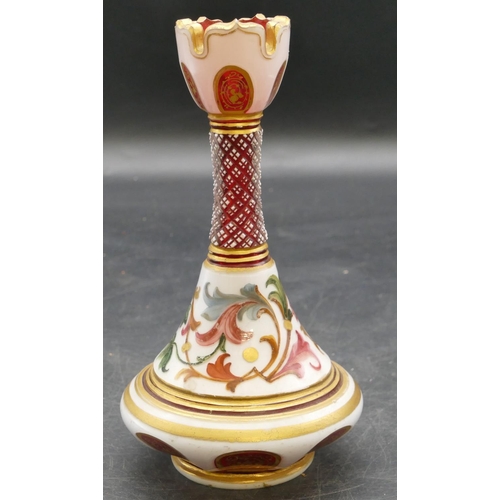 65 - A Venetian ruby and opaline round bulbous thin necked trumpet shaped vase with allover multicoloured... 