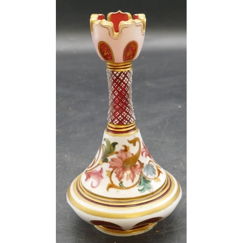 65 - A Venetian ruby and opaline round bulbous thin necked trumpet shaped vase with allover multicoloured... 