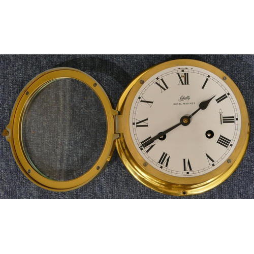 653 - Schatz gilt metal ship's wall clock with white enamel dial and Roman numerals, 18cm diameter