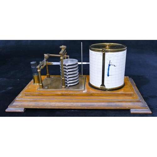 660 - A brass and oak barograph on splayed feet, 35cm wide