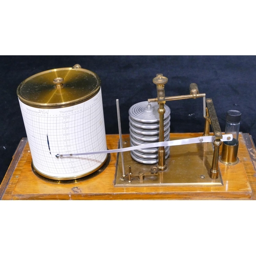 660 - A brass and oak barograph on splayed feet, 35cm wide