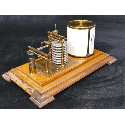 660 - A brass and oak barograph on splayed feet, 35cm wide