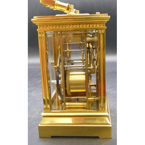 661 - A French brass repeat carriage clock striking on the half hour (stamped Patent Surety Poller), also ... 