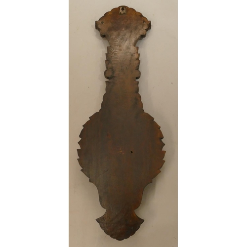 662 - A carved oak banjo barometer and thermometer with leaf and scroll decoration, 84cm high