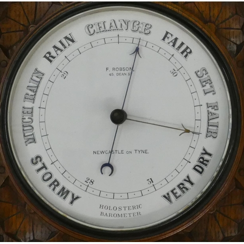 663 - F Robson, Newcastle on Tyne, holosteric oak hanging barometer with all over carved leaf and scroll d... 