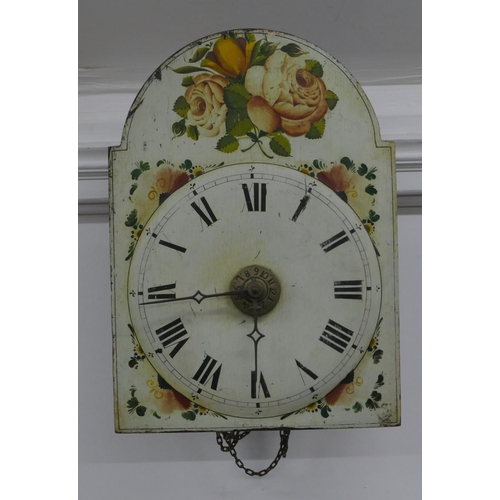 665 - A Black Forest alarm wall clock with painted arched dial and rose and leaf decoration, 42cm high