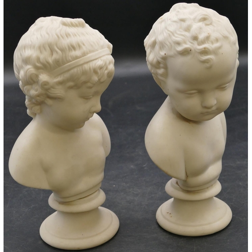 67 - 2 small bisque busts of children on round sweeping bases, 19cm high