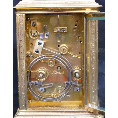 670 - A gilt metal and enamelled alarm bell strike carriage clock with chased swag and scroll decoration, ... 