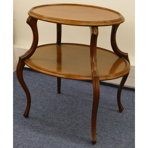 675 - An oval mahogany 2-tier occasional table on cabriole legs, 75cm wide, 75cm high