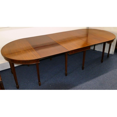 676 - An Edwardian mahogany triple pedestal D-end dining table with 2 additional leaves on square tapered ... 