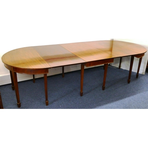 676 - An Edwardian mahogany triple pedestal D-end dining table with 2 additional leaves on square tapered ... 