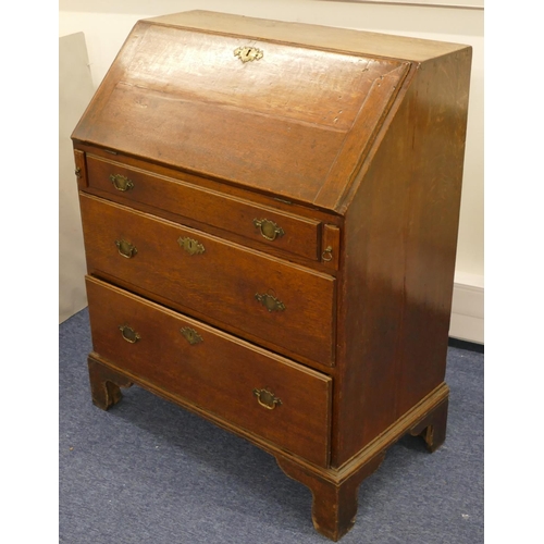 682 - An 18th Century small oak bureau with fall front, enclosing well, panelled door, secret compartments... 