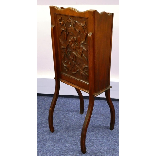 684 - A walnut tall rectangular shaped jardinière/magazine rack with carved panel, raised floral and leaf ... 