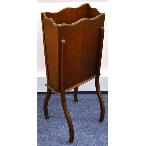 684 - A walnut tall rectangular shaped jardinière/magazine rack with carved panel, raised floral and leaf ... 