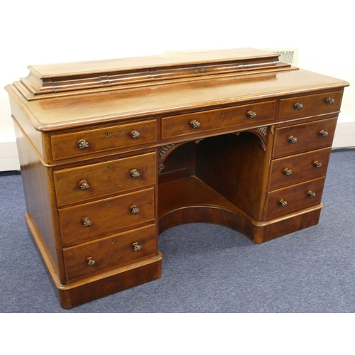 689 - A Victorian mahogany kneehole dressing table/desk with 5 short drawers to top, centre drawer above c... 