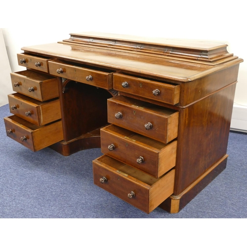 689 - A Victorian mahogany kneehole dressing table/desk with 5 short drawers to top, centre drawer above c... 