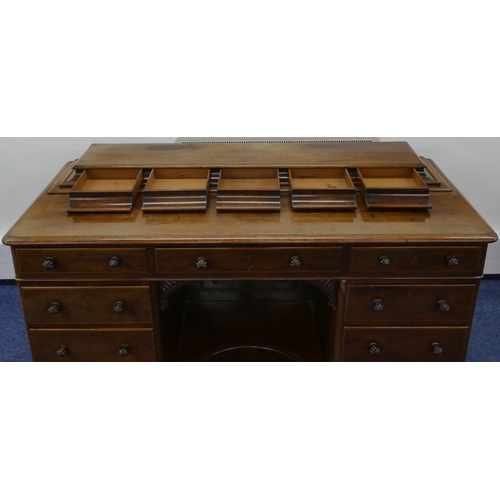 689 - A Victorian mahogany kneehole dressing table/desk with 5 short drawers to top, centre drawer above c... 