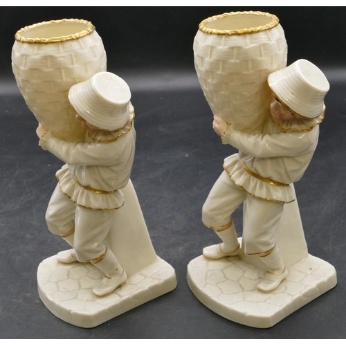 69 - A pair of 19th Century Worcester vases in the form of boys holding wicker baskets on white ground wi... 