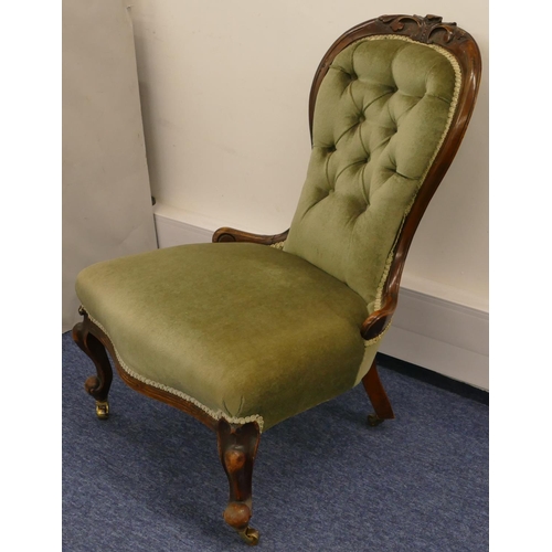 692 - A Victorian walnut spoon back nursing chair with green velvet overstuffed seat and button back, rais... 