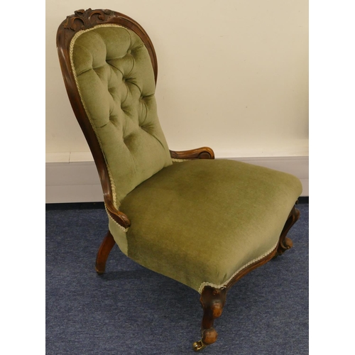 692 - A Victorian walnut spoon back nursing chair with green velvet overstuffed seat and button back, rais... 