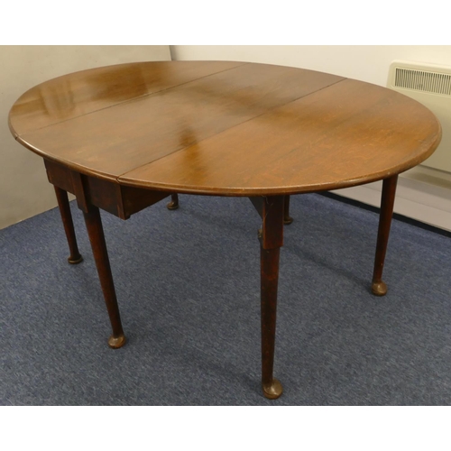 693 - A good quality oak 6-legged oval drop leaf dining table, 156cm x 117cm