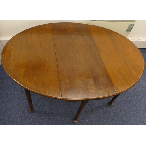 693 - A good quality oak 6-legged oval drop leaf dining table, 156cm x 117cm