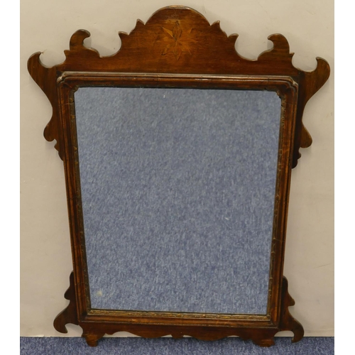 698 - A mahogany hanging wall mirror with inlaid star motif and scroll sides, 70cm high, 49.5cm wide