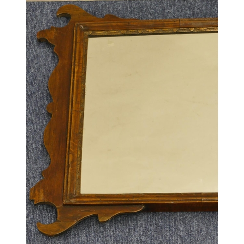 698 - A mahogany hanging wall mirror with inlaid star motif and scroll sides, 70cm high, 49.5cm wide