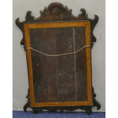 698 - A mahogany hanging wall mirror with inlaid star motif and scroll sides, 70cm high, 49.5cm wide