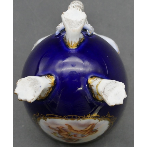 70 - A Meissen cabinet cup and saucer on royal blue ground with panels of cupids and allover gilt decorat... 