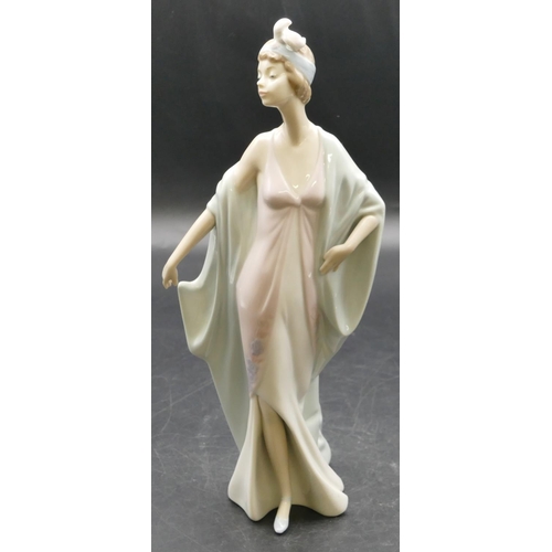 8 - A Lladro figure of a 1920's lady, 26cm high