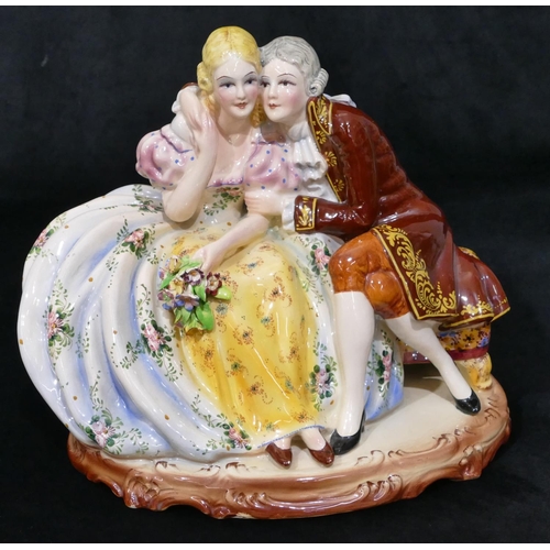 81 - A Continental large china group of 2 seated lovers, 29cm wide