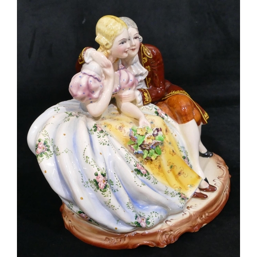 81 - A Continental large china group of 2 seated lovers, 29cm wide