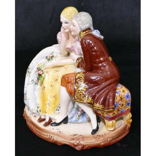 81 - A Continental large china group of 2 seated lovers, 29cm wide